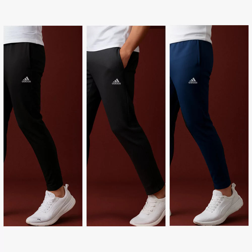 Three pairs of stride leggings in black, gray, and navy with white shoes on a red background.