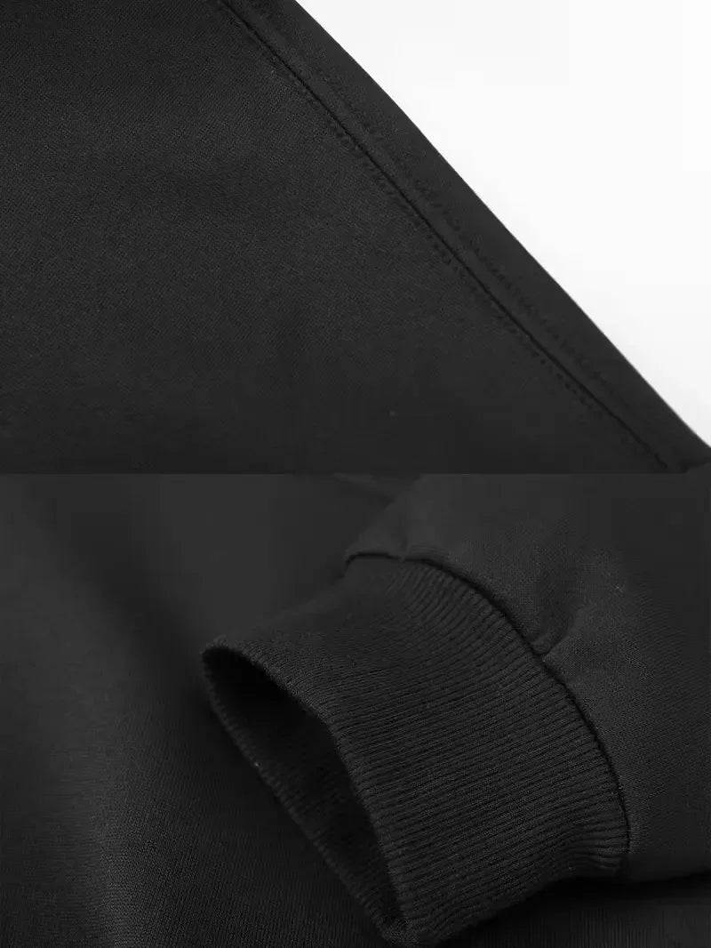 Close-up of a black hoodie sleeve on a white background