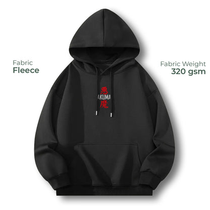 A black hooded sweatshirt with a kangaroo pocket and drawstrings, shown on a white background with text overlays reading 'Fabric Fleece' and 'Fabric Weight 320 gsm'. The chest has a small red and white graphic.